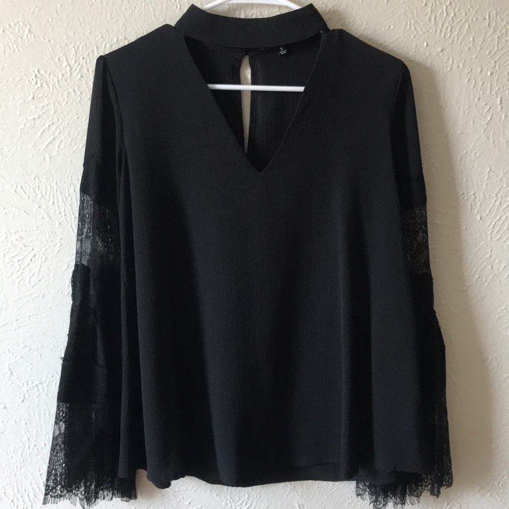 Lulus black long sleeve top with lace detailing.